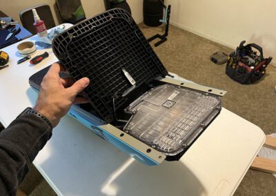 The Onewheel GT front footpad being removed.
