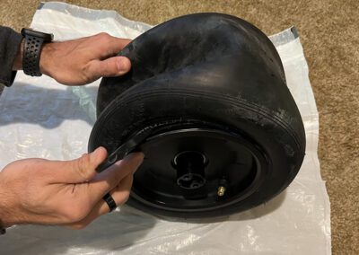 The Onewheel GT tire being removed.