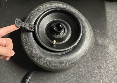 The Onewheel Pint X tire being removed.